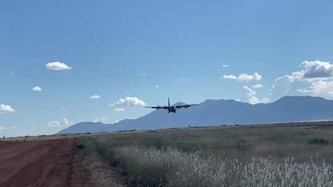 U.S. Air Force C-130 Hercules landing on dirt runway at Fort Huachuca, Arizona  Stock Footage 295188641