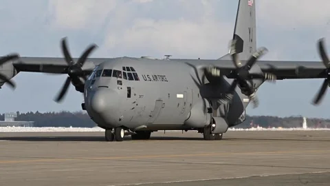 A U.S. Air Force C-130 Hercules aircraft taxis along the flightline Stock Footage 297953360