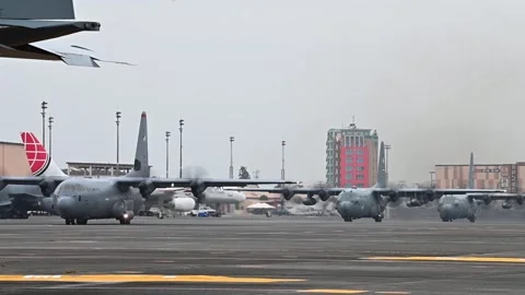 U.S Air Force C-130J Super Hercules and C-130H Hercules taxiing, Yokota Air Base Stock Footage 289283242