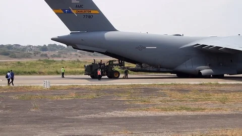 U.S. Air Force C-17 Cargo Plane Unloads Relief Supplies for Venezuela- w/Pan Stock Footage 104046678