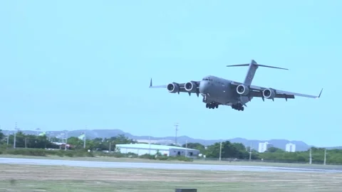 U.S. Air Force C-17 Globemaster aircraft touching down Stock Footage 260884137