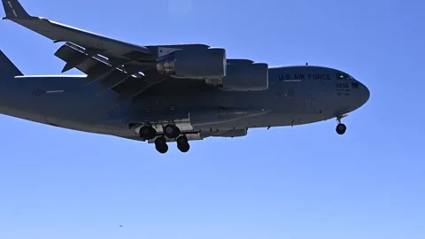 U.S. Air Force C-17 Globemaster III landing in desert Stock Footage 263189683