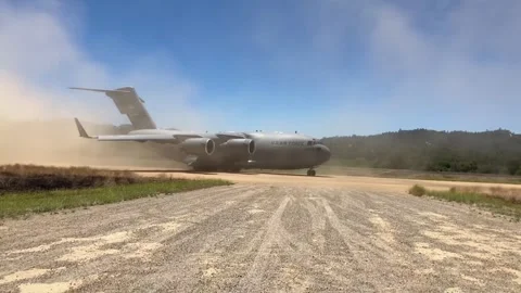 U.S. Air Force C-17 Globemaster turning on dirt runway Stock Footage 278581211