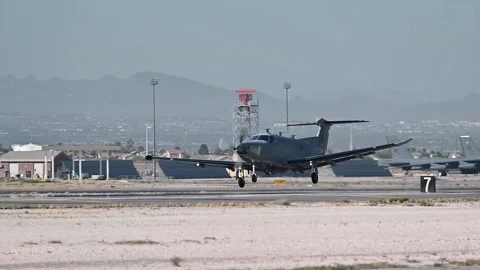 U.S. Air Force C-1U-28 Draco taking off from Nellis AFB, Nevada Stock Footage 276829716
