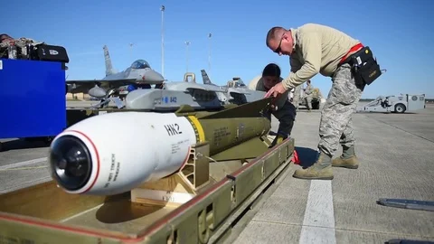 U.S. Air Force crew building weaponry during training program with F-16 Stock Footage 83309262