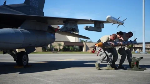 U.S. Air Force crew carrying weapon during building and loading program Stock Footage 83309112