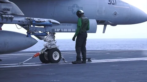 US Air Force engineer anchoring a combat jet for technical review Stock Footage 93743597