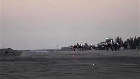 U.S. Air Force F-15E Strike Eagles taxiing on arrival in Middle East Stock Footage 256638837