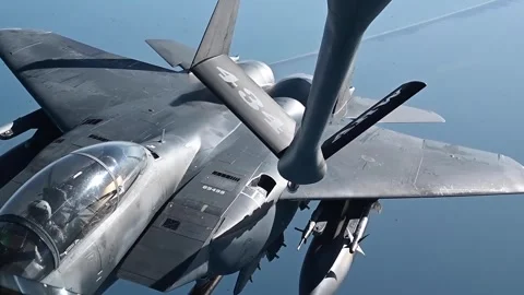 U.S. Air Force F-15E Strike Eagle preparing to refuel with KC-135 in midair Stock Footage 295033752