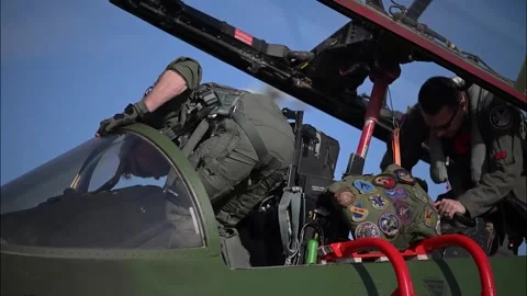 U.S. Air Force F-15E Strike Eagle pilot climbs into the cockpit Stock Footage 334652680