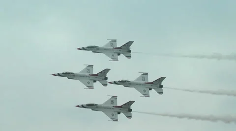 US Air Force F-16 Thunderbirds jet demonstration team fly-by diamond of 4 tilted Stock Footage