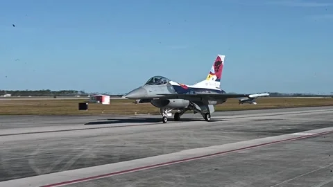 U.S. Air Force F-16 Fighting Falcon with tail art taxiing on flightline Stock Footage 255283986