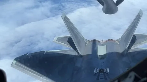 U.S. Air Force F-22 Raptor completes aerial refueling with KC-135 Stratotanker Stock Footage 278213697
