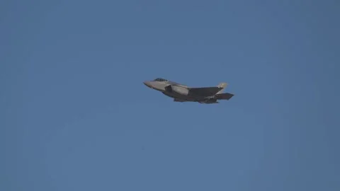 U.S. Air Force F-35A Demonstration pilot performing over snow covered mountains Stock Footage 259166538