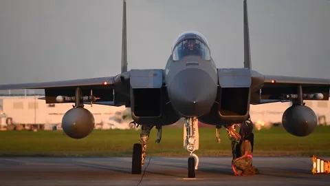 U.S. Air Force ground crew removes 'Remove before Flight' tags from F-15 Eagle Stock Footage 212049031