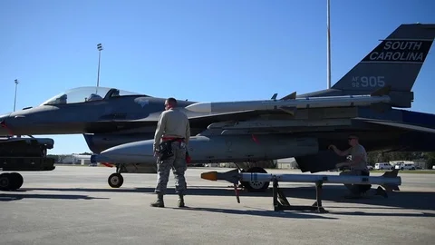 U.S. Air Force loading munitions onto F-16 Stock Footage 83309963