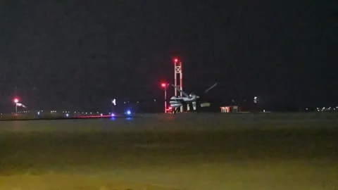 U.S. Air Force MQ-9 UAV taxiing at night Stock Footage 290334471