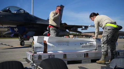 U.S. Air Force Munitions building program with F-16 Stock Footage 83309545