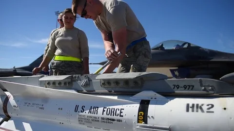 U.S. Air Force Munitions building program with F-16 Stock Footage 83309618