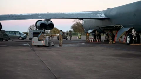 U.S. Air Force ordnancemen approaching B-52 Stratofortress on a bomb loader Stock Footage 293060644