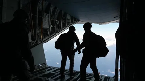 U.S. Air Force parachutists jumping from rear of MC-130J Commando II aircraft Stock Footage 258336005