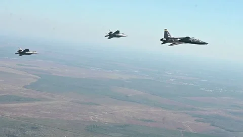 U.S. Air force T-38C Talon aircraft flying with two F-35A Lightning II's Stock Footage 255283887