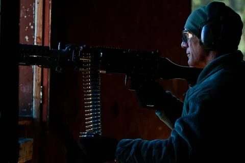 U.S. Air Force Tech. Sgt. Jack Baum mans an M240B machine gun while playin... Stock Photos