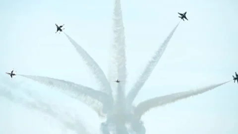U.S. Air Force Thunderbird F-16 aircraft performing aerobatics with smoke Stock Footage 257413714
