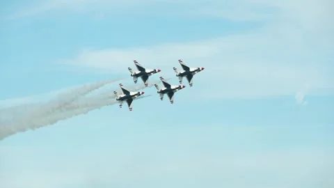 U.S. Air Force Thunderbirds demonstration team perform trail to diamond maneuver Stock Footage 257413692