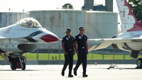 U.S. Air Force Thunderbirds demonstration team maintainers synchronized walk Stock Footage 257413763