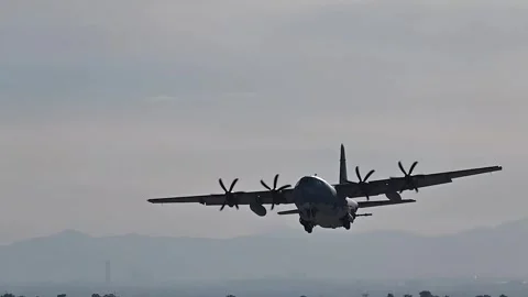 U.S. Air Force Weapons School AC-130 Gunship aircraft taking off from Nellis AFB Stock Footage 258229198