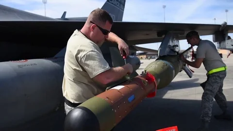 U.S. Airman securing weapon on F-16 during building and loading program Stock Footage 83306500