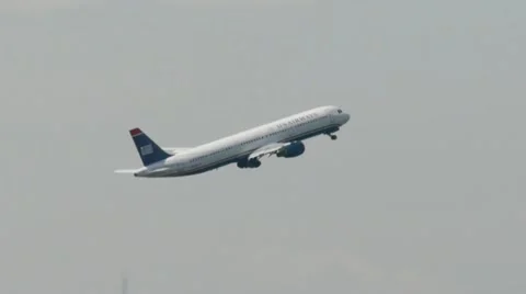 US Airways airplane flying ascension take off from LaGuardia Airport New York Stock Footage