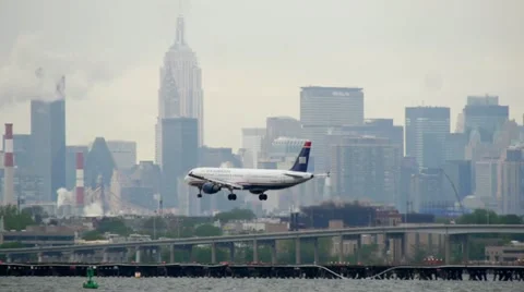 US Airways Airplane Landing LaGuardia Airport New York City cloudy Stock Footage