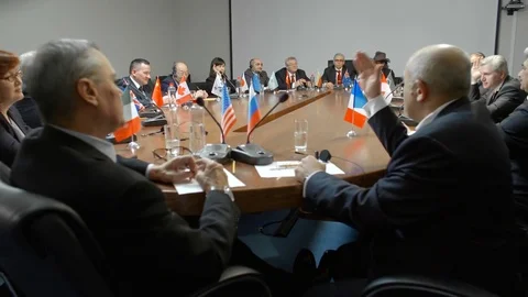 US and Russian participants discuss conflict in Syria on the sidelines of Stock Footage
