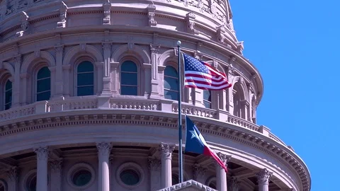US and Texas Flags waving in the wind at the Texas State Capital Building Stock Footage 105206265