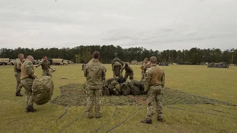 U.S and U.K. troops load CH-47 Chinooks during CJOAX 15-01 - 2015 Video stock 99980325