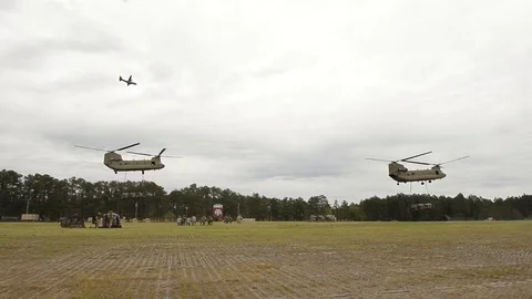 U.S and U.K. troops load CH-47 Chinooks during CJOAX 15-01 - 2015 Video stock 99980361