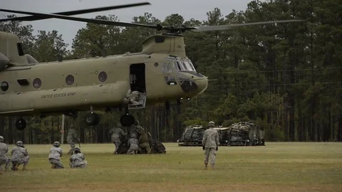 U.S and U.K. troops load CH-47 Chinooks during CJOAX 15-01 - 2015 Stock Footage 99980406