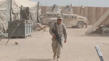 US armed soldier doing round inside the camp in Afghanistan Stock Footage 85602227