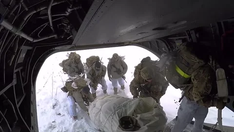 U.S. Army 10th Mountain Division soldiers loading sled onto CH-47 Chinook Video stock 262312746