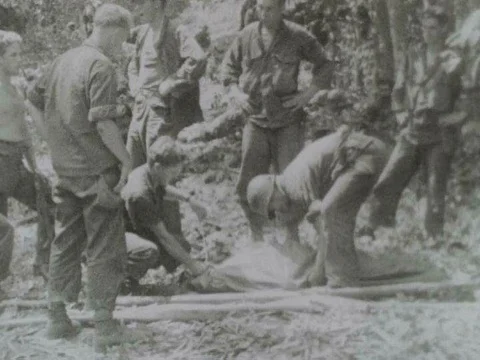 U.S. Army 3rd Battalion dig grave sites and bury their dead killed in battle inƒ Stock Footage 75298771