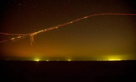 A U.S. Army AH-64 Apache attack helicopter fires at targets as part of exe... Stock Photos