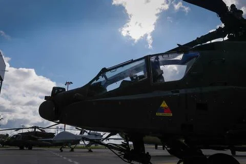 A U.S. Army AH-64E Apache Guardian attack helicopter assigned to the Comba... Stock Photos