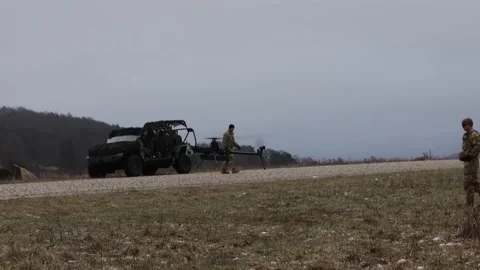 U.S. Army Anduril Ghost-X MR unmanned aerial vehicle landing Stock Footage 298193483