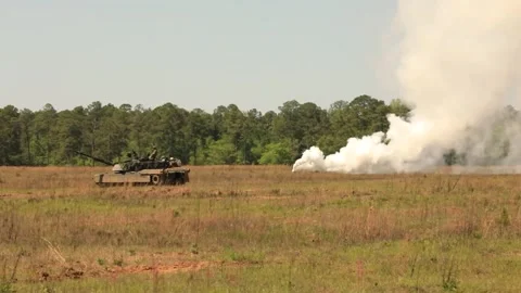 U.S. Army battle tank using smokescreen for cover Stock Footage 271338290