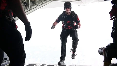 U.S. Army Black Dagger parachutists jump from C-130 Hercules Stock Footage 108312302