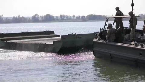 U.S. Army bridge erection boat approaching floating bridge Видео 160106783