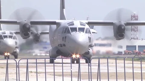 U.S. Army cargo planes ready to take off from airstrip Stock Footage 84575660