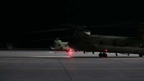 U.S. Army CH-47 Chinook helicopters ground running on airfield at night Vidéo 237686271